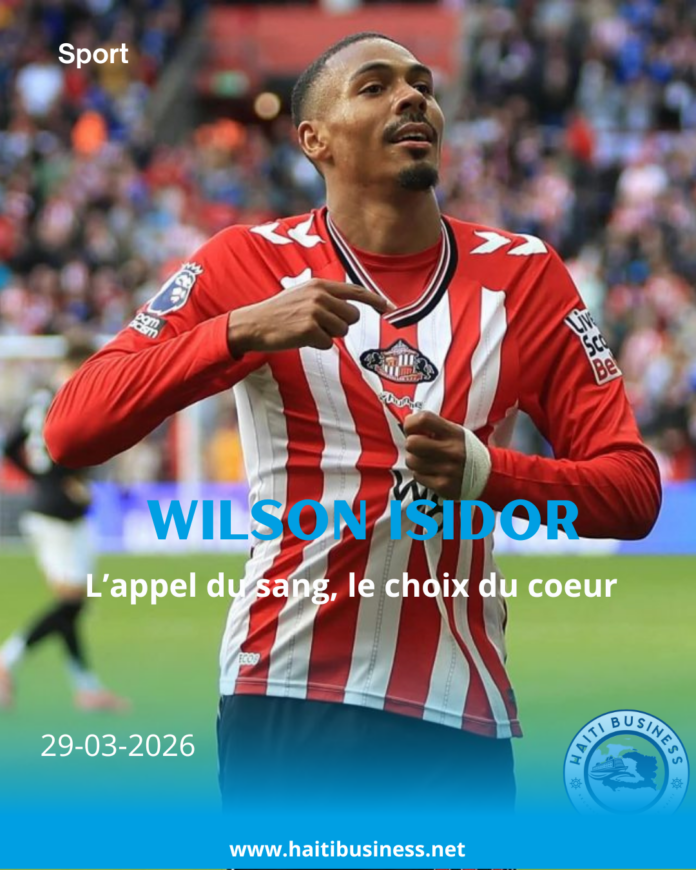 Wilson Isidor célébrant la montée en Premier League avec le drapeau d'Haïti sur les épaules